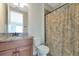 Clean bathroom with granite countertop and shower/tub combo at 7315 Bianco Duck Ct, Sarasota, FL 34240