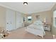 Well-lit bedroom featuring a double bed and ample closet space at 7315 Bianco Duck Ct, Sarasota, FL 34240