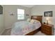 Bright bedroom with a queen bed and natural light at 7315 Bianco Duck Ct, Sarasota, FL 34240