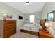 Cozy bedroom with a comfortable bed and plenty of storage at 7315 Bianco Duck Ct, Sarasota, FL 34240