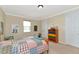 Bright bedroom with a double bed and colorful dresser at 7315 Bianco Duck Ct, Sarasota, FL 34240