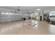 Large garage with epoxy flooring, ample storage, and room for gym equipment at 7315 Bianco Duck Ct, Sarasota, FL 34240