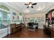 Bright home office features built-in shelving and hardwood floors at 7315 Bianco Duck Ct, Sarasota, FL 34240