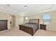 Large main bedroom with a king-size bed and ensuite bathroom access at 7315 Bianco Duck Ct, Sarasota, FL 34240