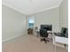 Home office with desk, chair, and built in shelving at 7315 Bianco Duck Ct, Sarasota, FL 34240