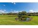 Serene pond with lush landscaping, creating a tranquil atmosphere at 7315 Bianco Duck Ct, Sarasota, FL 34240