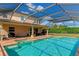 Large, refreshing pool with a screened enclosure and ample deck space for relaxation at 7315 Bianco Duck Ct, Sarasota, FL 34240