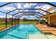 Beautiful screened pool with patio, spa, and picturesque golf course views at 7315 Bianco Duck Ct, Sarasota, FL 34240