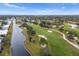 Aerial view showing home near golf course and waterway at 7460 W Country Club N Dr, Sarasota, FL 34243