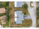 Top-down view of two-unit home with surrounding landscape at 7460 W Country Club N Dr, Sarasota, FL 34243