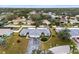 Aerial view of two-unit home in residential neighborhood at 7460 W Country Club N Dr, Sarasota, FL 34243