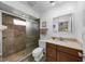 Updated bathroom with walk-in shower and modern vanity at 7460 W Country Club N Dr, Sarasota, FL 34243