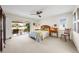 Bright main bedroom with patio access and antique furniture at 7460 W Country Club N Dr, Sarasota, FL 34243