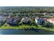 Waterfront property situated amongst other homes with lush green lawns at 7555 Tori Way, Lakewood Ranch, FL 34202