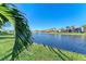 Peaceful lakefront backyard with lush landscaping and stunning views at 7555 Tori Way, Lakewood Ranch, FL 34202