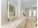 Elegant bathroom featuring a soaking tub and a large vanity at 7555 Tori Way, Lakewood Ranch, FL 34202