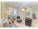 Open living room with a view of the entryway and dining room at 7555 Tori Way, Lakewood Ranch, FL 34202