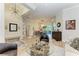 Open concept living area with a view into the dining room and kitchen at 7555 Tori Way, Lakewood Ranch, FL 34202