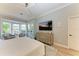 Main bedroom with king bed and large dresser at 7555 Tori Way, Lakewood Ranch, FL 34202