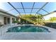 Large screened pool and spa with a relaxing patio area at 7555 Tori Way, Lakewood Ranch, FL 34202