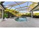 Enjoy this beautiful screened pool and spa with plenty of patio space at 7555 Tori Way, Lakewood Ranch, FL 34202