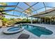 Relax in this screened pool and spa with gorgeous backyard views at 7555 Tori Way, Lakewood Ranch, FL 34202