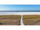 Beachfront property with path leading to white sand beach at 757 Beach Rd # 208, Sarasota, FL 34242