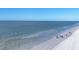 People walking along the beach near the ocean at 757 Beach Rd # 208, Sarasota, FL 34242