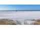 White sand beach view with lifeguard stand in the distance at 757 Beach Rd # 208, Sarasota, FL 34242