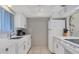 Well-equipped kitchen with white cabinets and modern appliances at 757 Beach Rd # 208, Sarasota, FL 34242