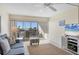 Living room with ocean view, comfy seating, and large TV at 757 Beach Rd # 208, Sarasota, FL 34242