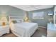 Main bedroom with a king-size bed and ocean view at 757 Beach Rd # 208, Sarasota, FL 34242