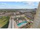 Aerial view of resort-style pool and surrounding building at 800 N Tamiami Trl # 1502, Sarasota, FL 34236