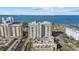 Drone view showcasing a condo building near the waterfront at 800 N Tamiami Trl # 1502, Sarasota, FL 34236