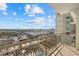 Balcony view overlooking the city skyline and pool at 800 N Tamiami Trl # 1502, Sarasota, FL 34236