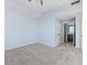 Spacious bedroom with neutral walls and ceiling fan at 800 N Tamiami Trl # 1502, Sarasota, FL 34236