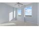 Bright bedroom with carpet flooring and large windows at 800 N Tamiami Trl # 1502, Sarasota, FL 34236