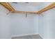 Large walk-in closet with custom wood shelving at 800 N Tamiami Trl # 1502, Sarasota, FL 34236