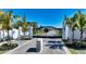 Gated community entrance with palm trees and landscaped medians at 8005 20Th W Pl, Bradenton, FL 34209