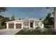 Craftsman style home with two car garage and manicured landscaping at 8005 20Th W Pl, Bradenton, FL 34209