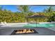 Relaxing pool area with fire pit and comfortable seating at 8005 20Th W Pl, Bradenton, FL 34209