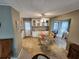 Cozy dining area with glass table and wicker chairs at 808 53Rd E Ave # 76, Bradenton, FL 34203