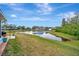 Peaceful backyard with pond view and lush landscaping at 839 Manchester Woods Dr # 25, Sun City Center, FL 33573