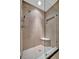 Large walk-in shower with tiled bench and glass enclosure at 839 Manchester Woods Dr # 25, Sun City Center, FL 33573