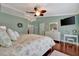 Bright bedroom with a floral comforter and plenty of natural light at 839 Manchester Woods Dr # 25, Sun City Center, FL 33573