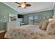 Spacious main bedroom with hardwood floors, ceiling fan, and plenty of natural light at 839 Manchester Woods Dr # 25, Sun City Center, FL 33573