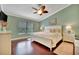 Spacious main bedroom with hardwood floors, ceiling fan, and plenty of natural light at 839 Manchester Woods Dr # 25, Sun City Center, FL 33573