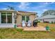 Relaxing patio with seating and grill, perfect for outdoor entertaining at 839 Manchester Woods Dr # 25, Sun City Center, FL 33573