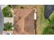 Aerial view of a house roof and surrounding landscape at 839 Manchester Woods Dr # 25, Sun City Center, FL 33573