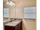 Bathroom boasts a granite vanity with modern fixtures at 87 Long Meadow Ln, Rotonda West, FL 33947